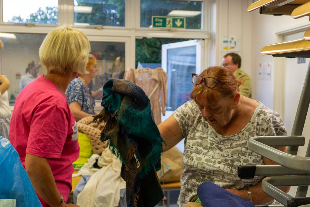 Kate Gould assisting with costume.